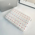 Women's polka dot polyester laptop bag showing three size options