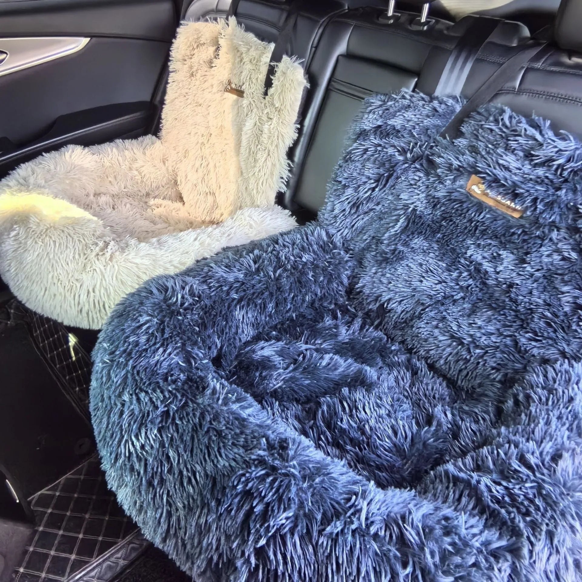 Dark grey thickened thermal pet mat placed on a car seat.