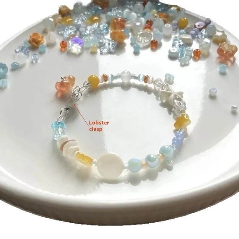 Orange gold-tone bracelet with water-soaked texture, diamond shape and round decorative elements