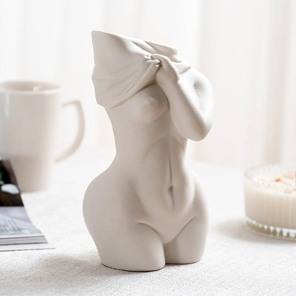 White porcelain figurative human vase with 21.2cm height on a shelf