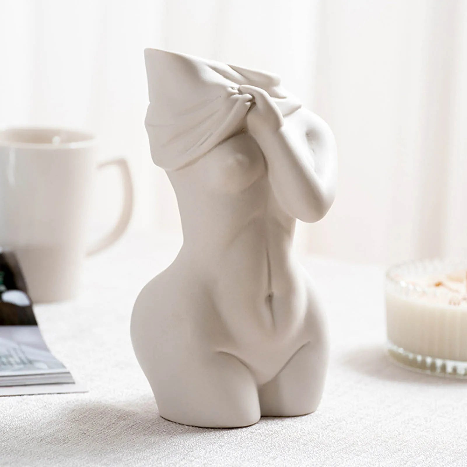 White porcelain figurative human vase with 21.2cm height on a shelf