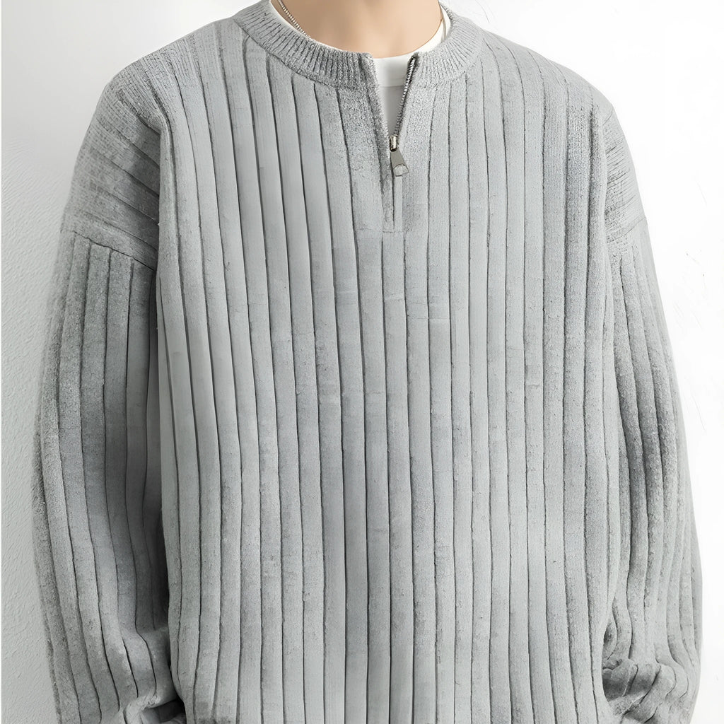 Men's grey half zip loose knit sweater with textured fabric and long sleeves