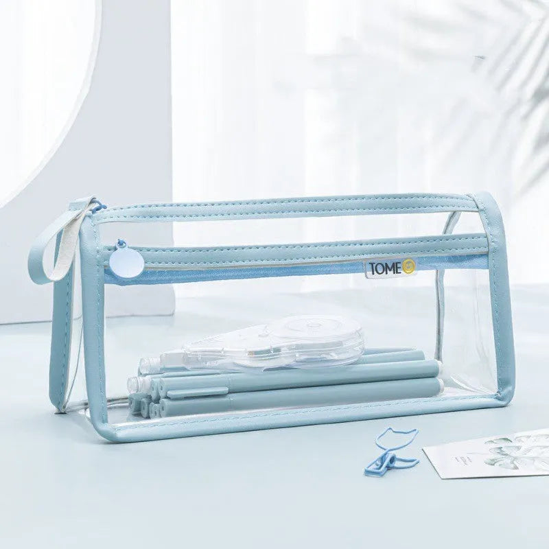 Large transparent double-layer pencil case in blue showing two compartments for exam stationery.
