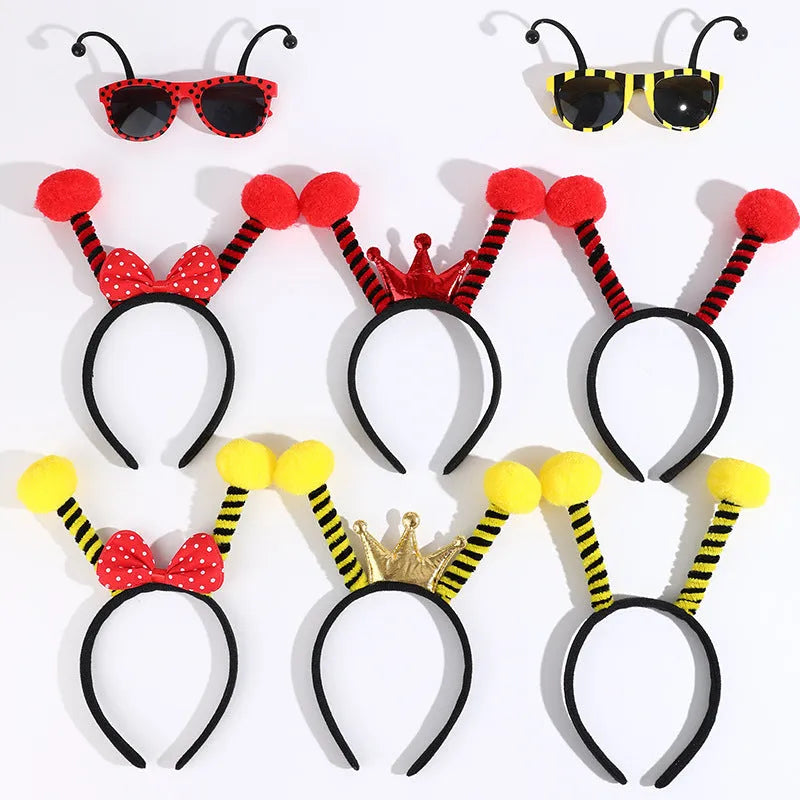 Yellow bee-themed party costume headband and glasses set on cloth material