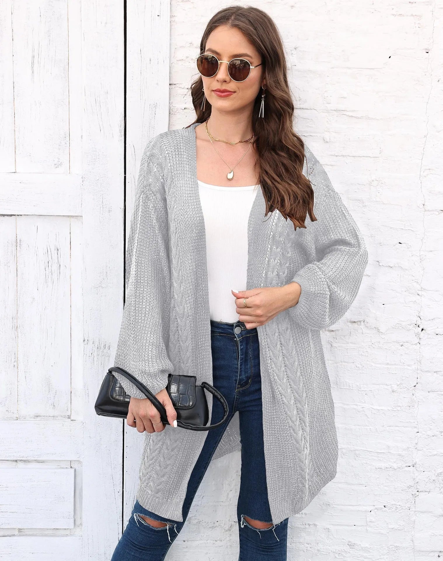 Women's loose-fit solid-colour acrylic sweater coat shown in light grey