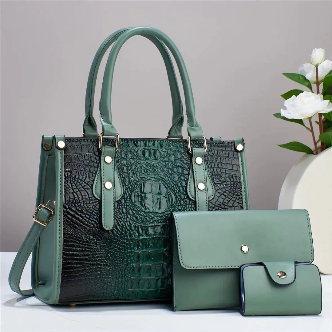 Women's burgundy PU leather three-piece bag set showing crossbody bag, wallet, and card holder.
