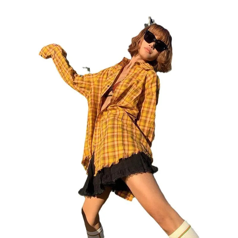 A man and woman wearing a loose-fitting dopamine yellow plaid cardigan shirt.