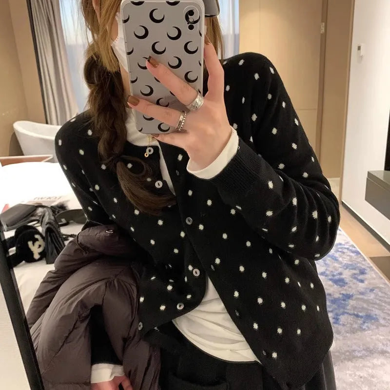 Grey Korean-style loose knitted cardigan with white crocheted flower details on the front.