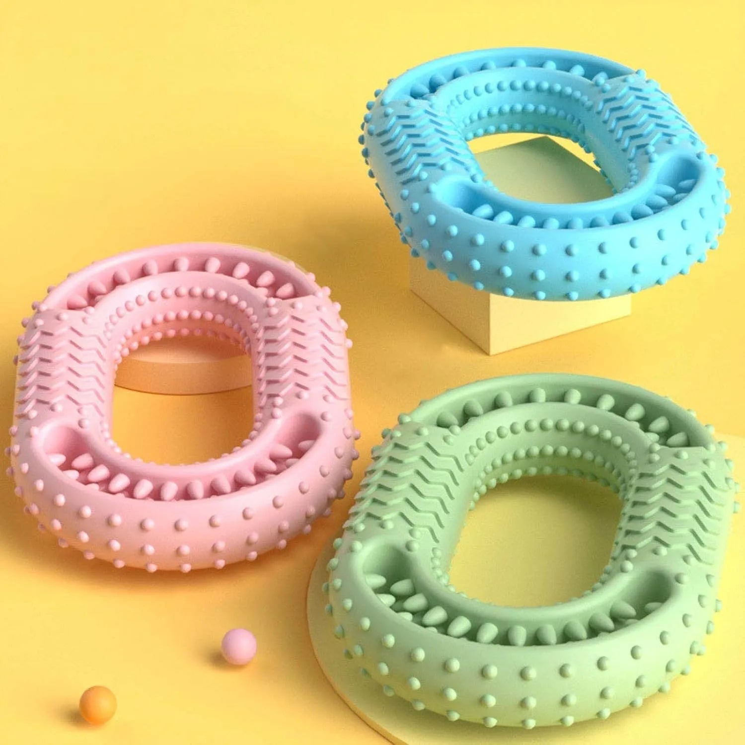 Blue O-ring shaped durable dog chew toy for aggressive chewers on a plain background.