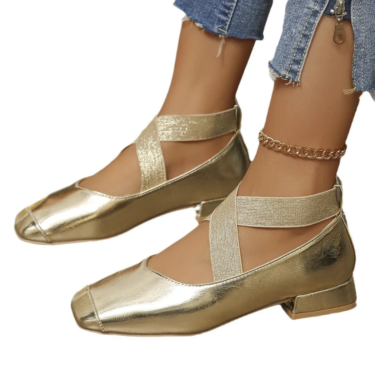 Gold slip-on evening pumps with a flared skirt collar, square toe and low rubber sole.