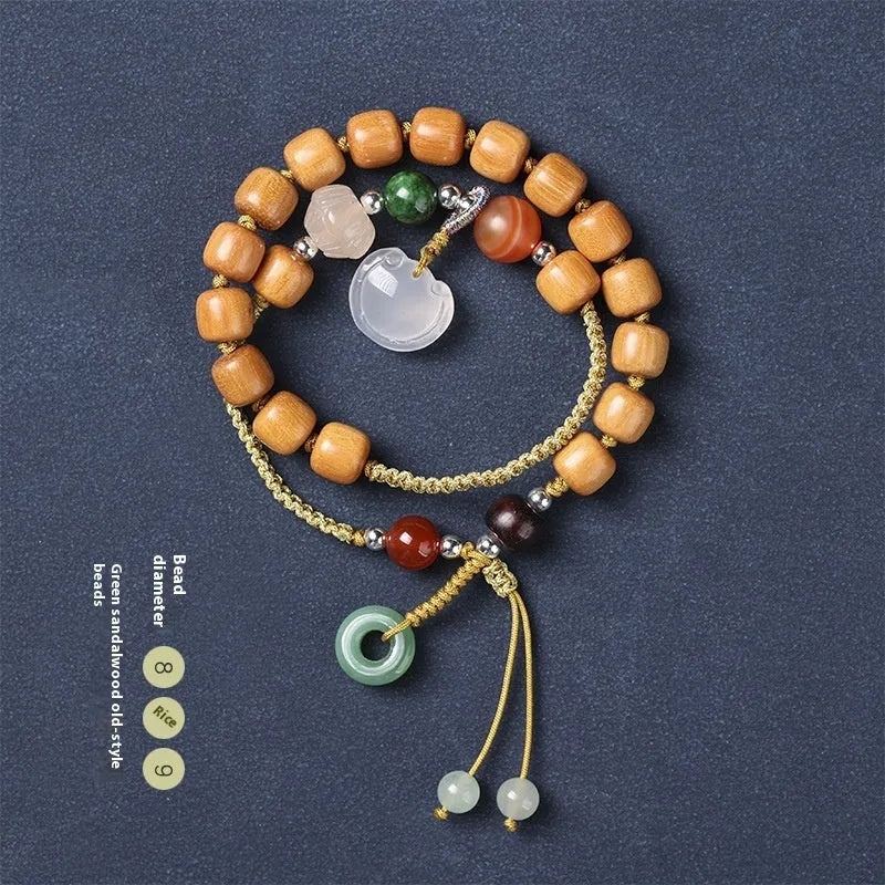 Women's hand-woven ebony double ring bracelet with traditional Ruyi motifs in Xiuyan jade or antique chalcedony