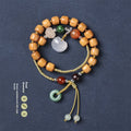 Women's hand-woven ebony double ring bracelet with traditional Ruyi motifs in Xiuyan jade or antique chalcedony