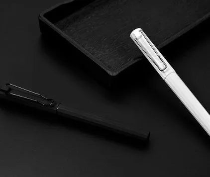 Three black decompression elastic pens with 0.7mm bullet tips and cap closure on a light background