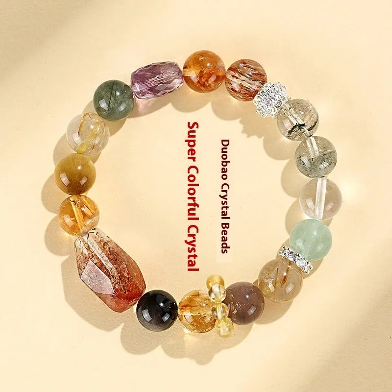 Natural Duobao crystal bead bracelet with black and gold beads on a woman's wrist.