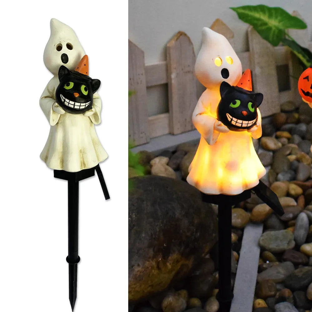 Solar Halloween pumpkin lantern on ground stake, wrought iron outdoor path light with 40x40mm solar panel, IP55 waterproof.