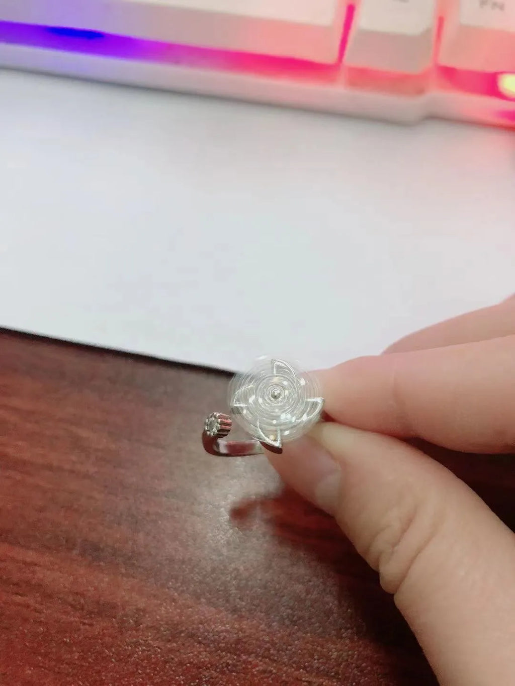 Women's geometric rotating ring with gold electroplated finish and circular decorative elements