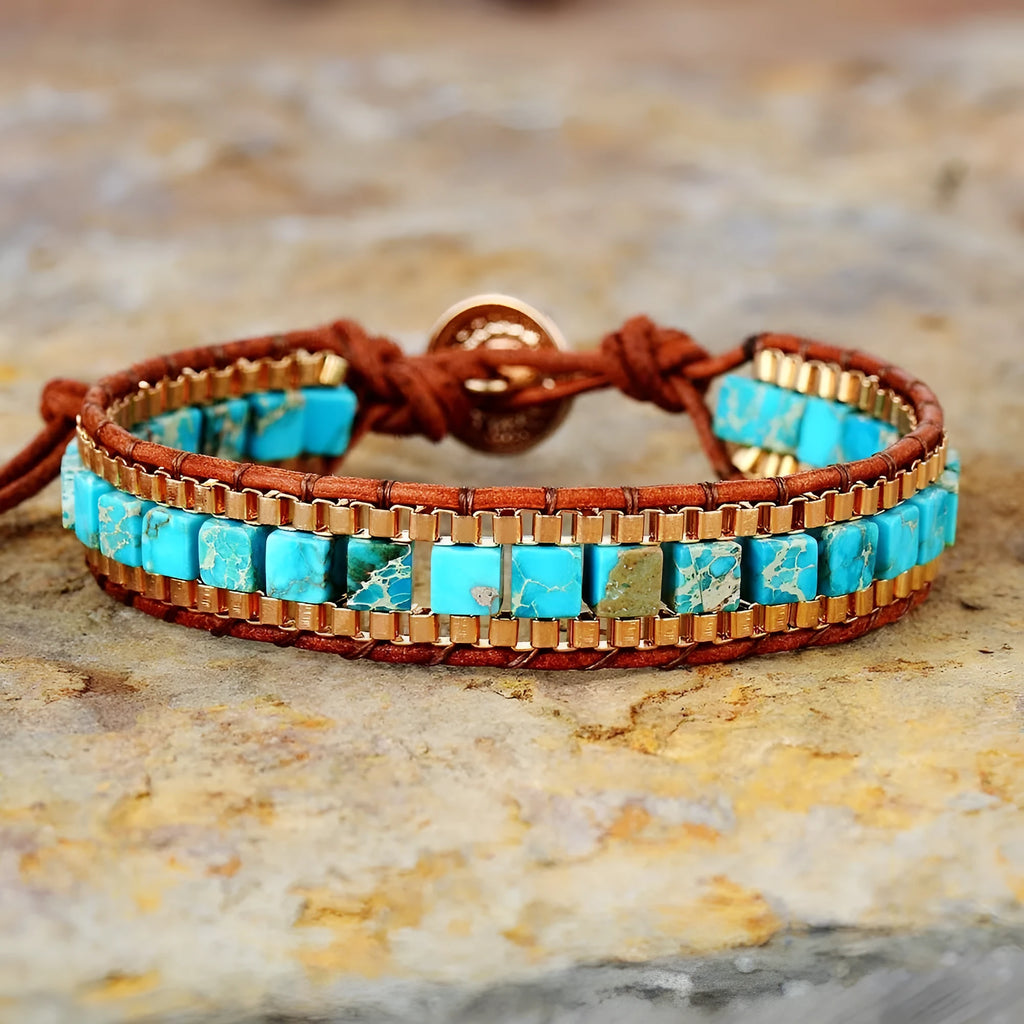 Blue hand-woven leather bracelet with geometric pattern on neutral background