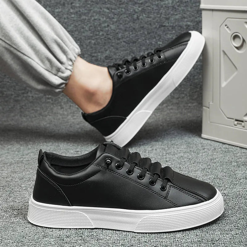 Men's black and white low top sports shoes with synthetic leather upper, mesh panels, and a flat PVC sole.
