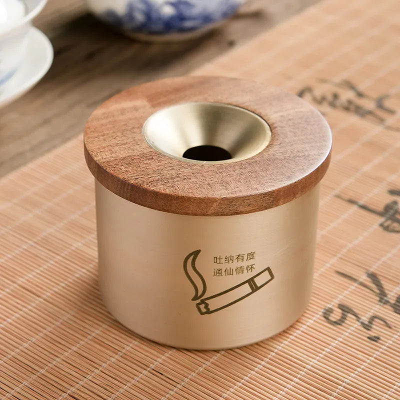 Retro brass ashtray with wooden lid showing centre hole design