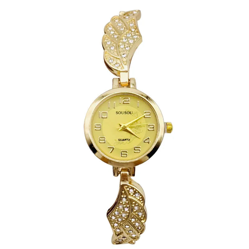 Women's stainless steel watch with round dial showing gold surface and vachette clasp