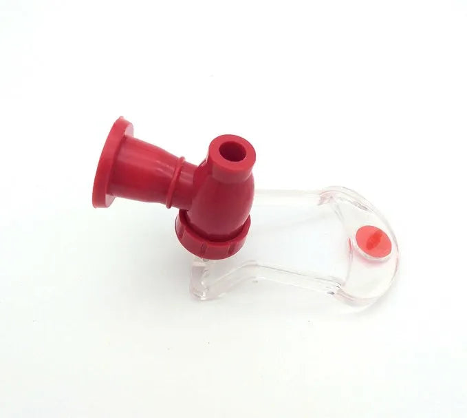 Red plastic Magic Tap soda dispenser attached to 2-litre bottle