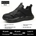 Black men's steel toe safety work shoes with felt buckle closure on a light background