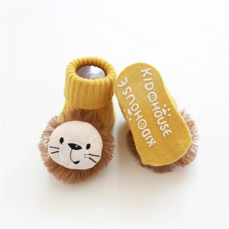 Cotton baby socks in multiple colours and designs including a panda pattern and a blue bow.