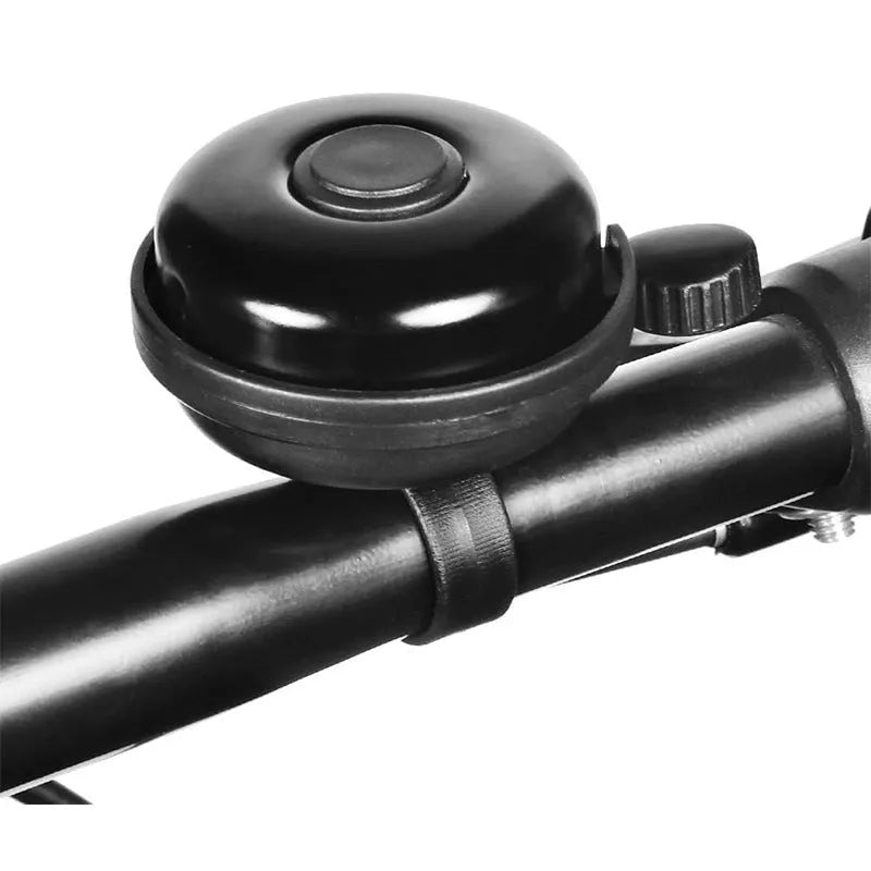 Black ABS plastic bicycle bell with 58mm diameter on a bicycle handlebar