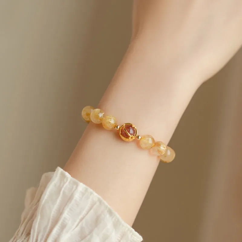 Gold rutilated quartz crystal bracelet with diamond cut stones in unisex Korean style design