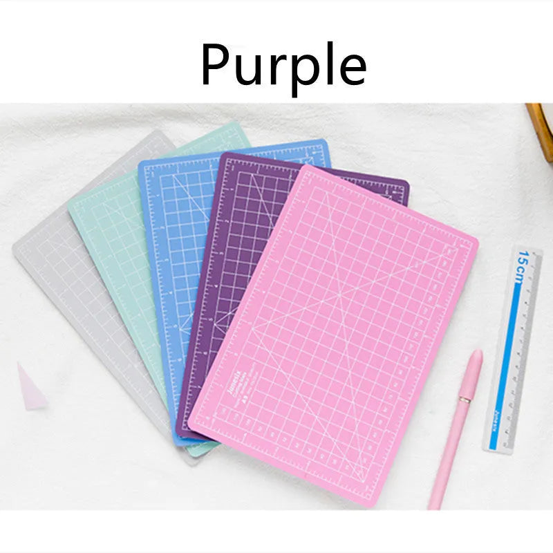 Art pen knife cutting board set with backing board, ruler, sharpener and blade in craft workspace