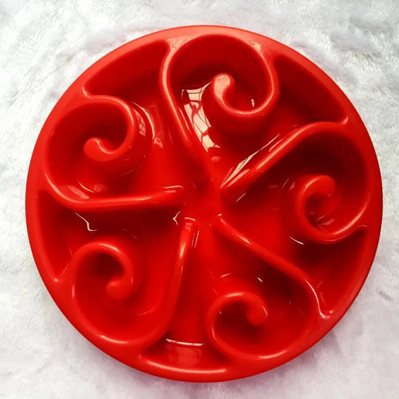 A coloured slow feeder dog bowl with a maze pattern and non-slip base, suitable for large, medium, and small dogs.