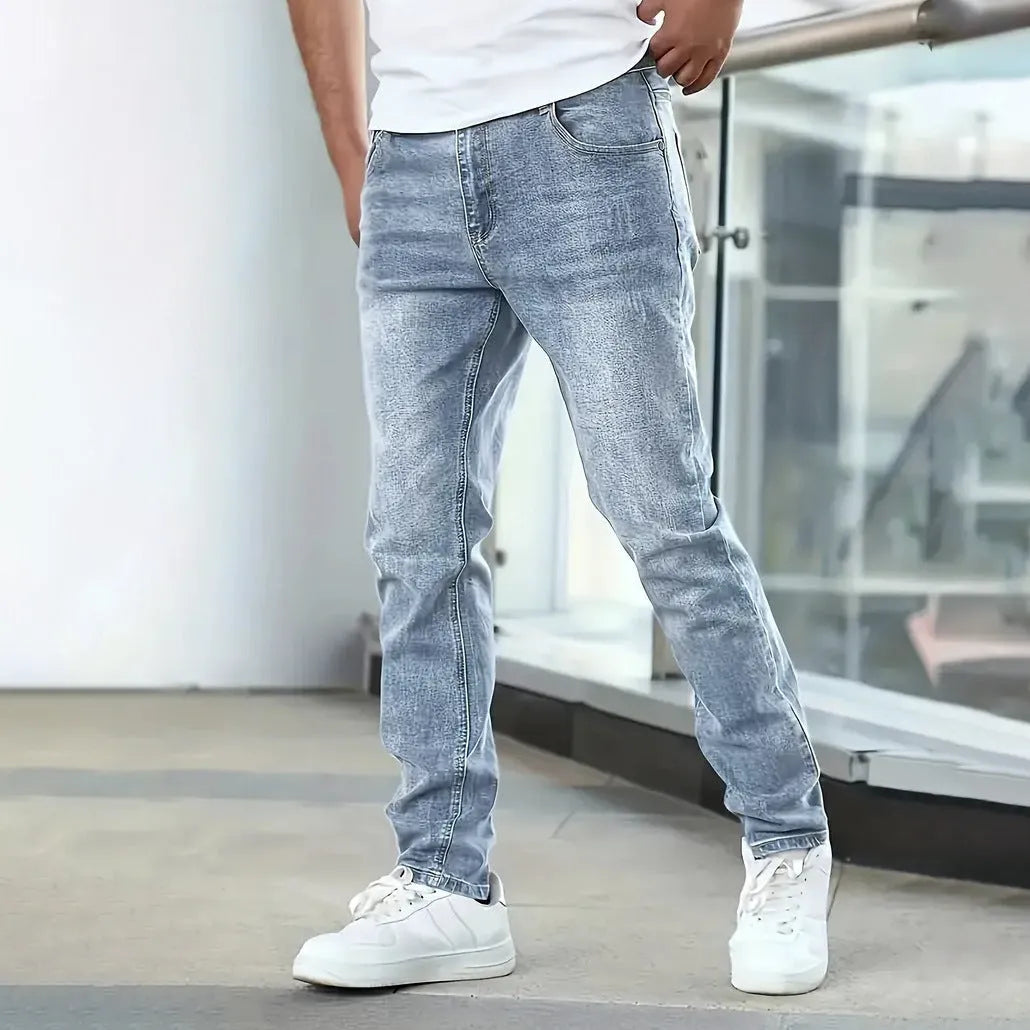 Men's black stretch skinny jeans showing high elasticity cotton-spandex fabric with zipper fly and straight leg cut