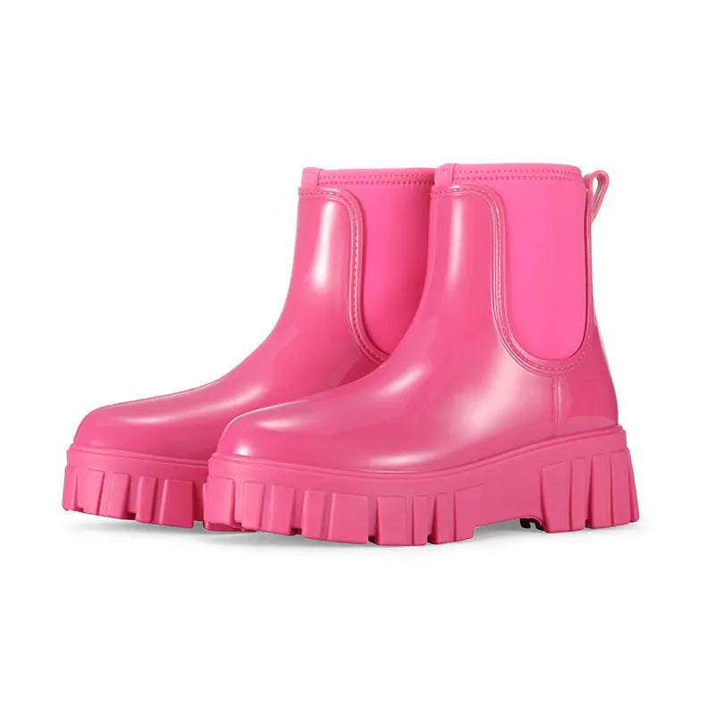 Low tube PVC rain boots in apricot colour with a non-slip sole and flat heel.