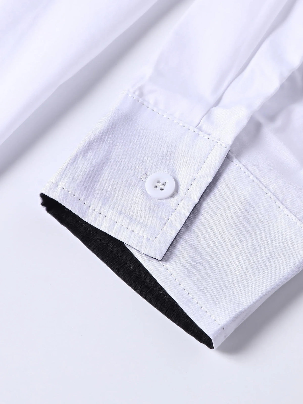 White long-sleeved shirt for teenage men with black contrast collar, cuffs and inner placket, button-down front