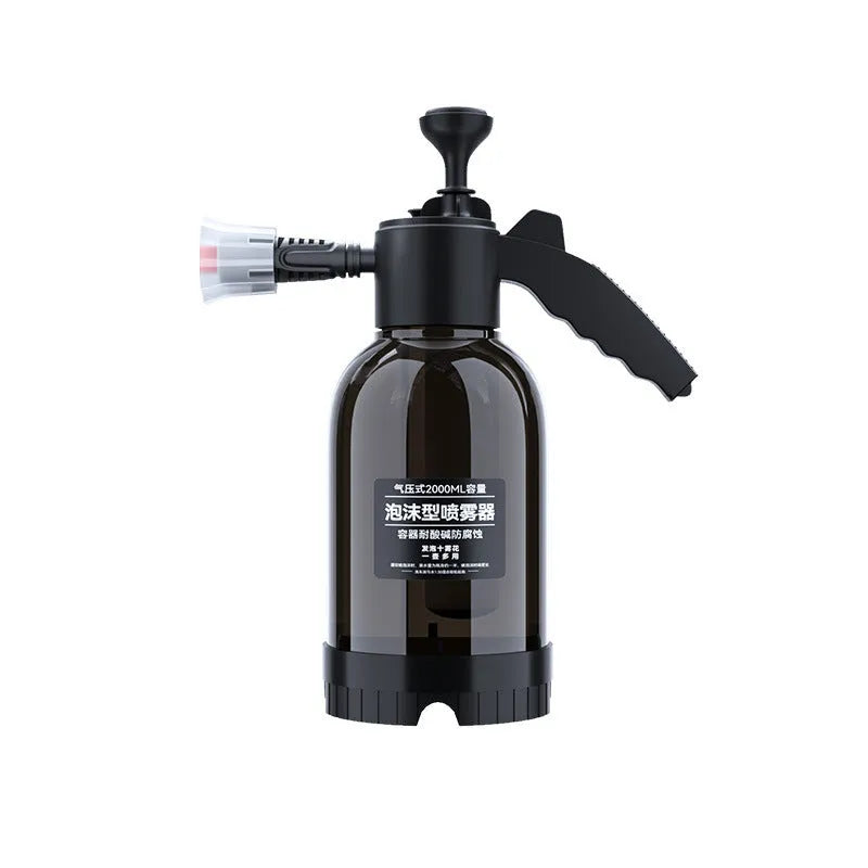 Black handheld 2L foam watering can sprayer with pump handle and two nozzles.