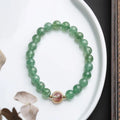 Natural green strawberry quartz bracelet with 7.5mm beads in geometric pattern