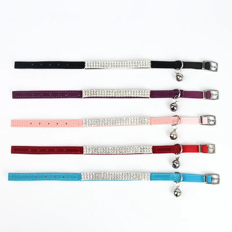 Velvet cat collar with rhinestones, adjustable from 20cm to 30cm, shown in multiple colour options.