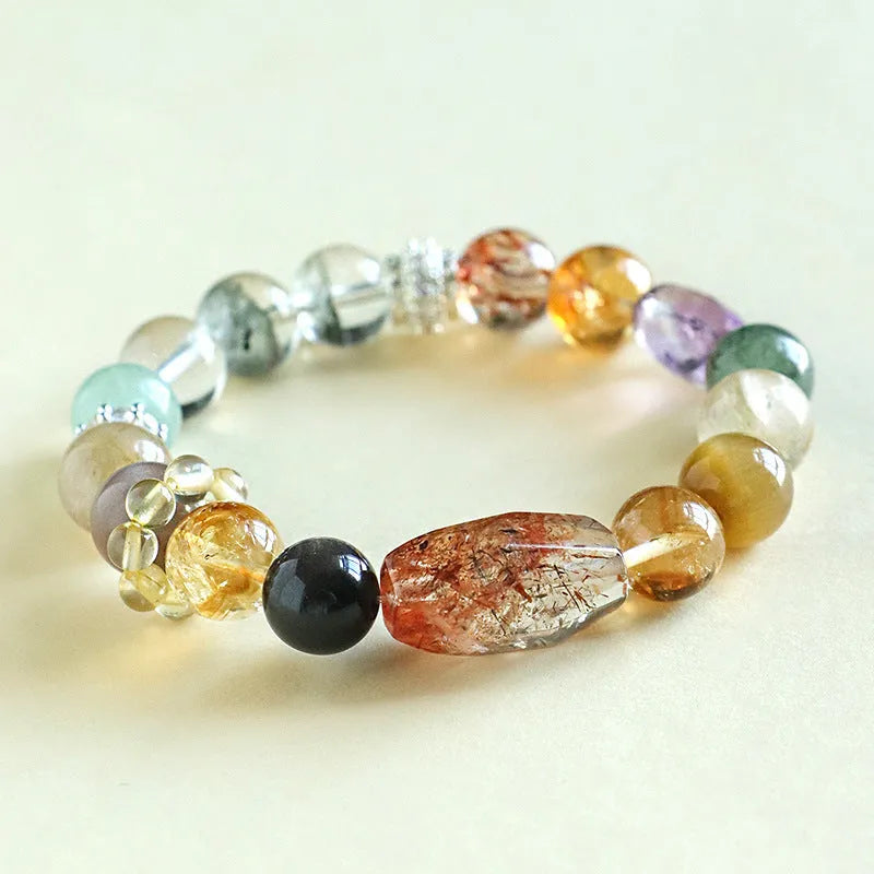 Natural Duobao crystal bead bracelet with black and gold beads on a woman's wrist.