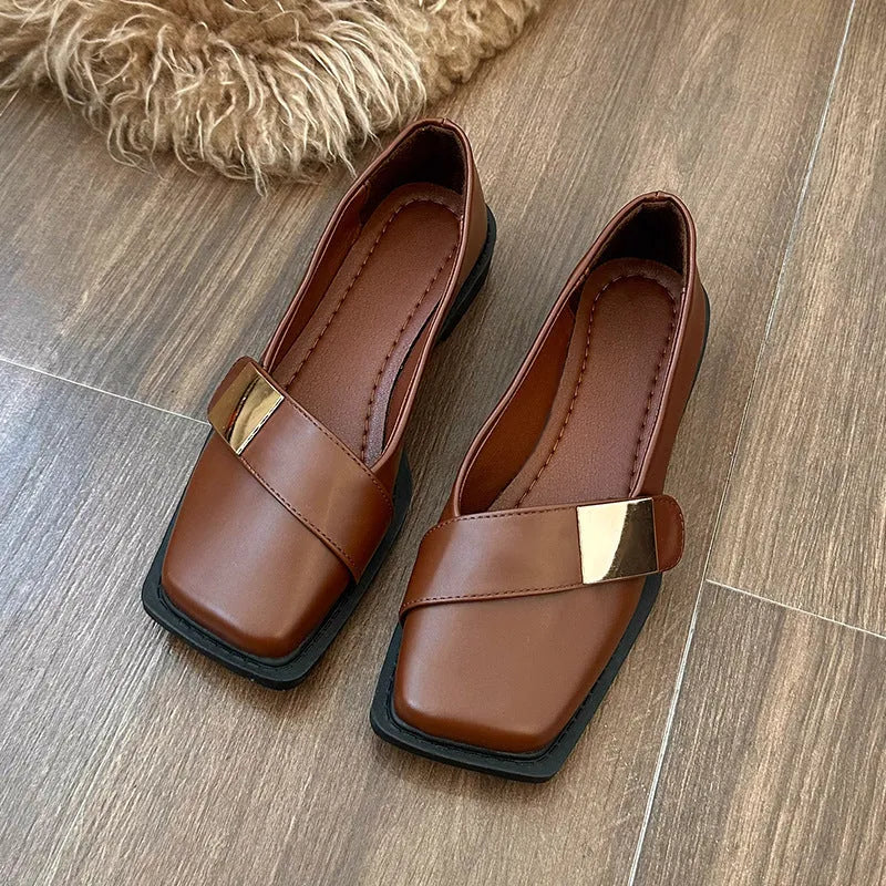 Women's beige artificial leather flat-heeled shoes with square toe and silver metal buckle.