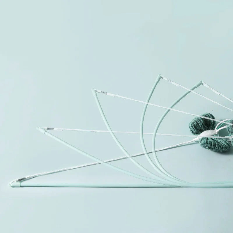 Blue cat toy wand with long pole and a bite-resistant rocket attachment decorated with feathers.