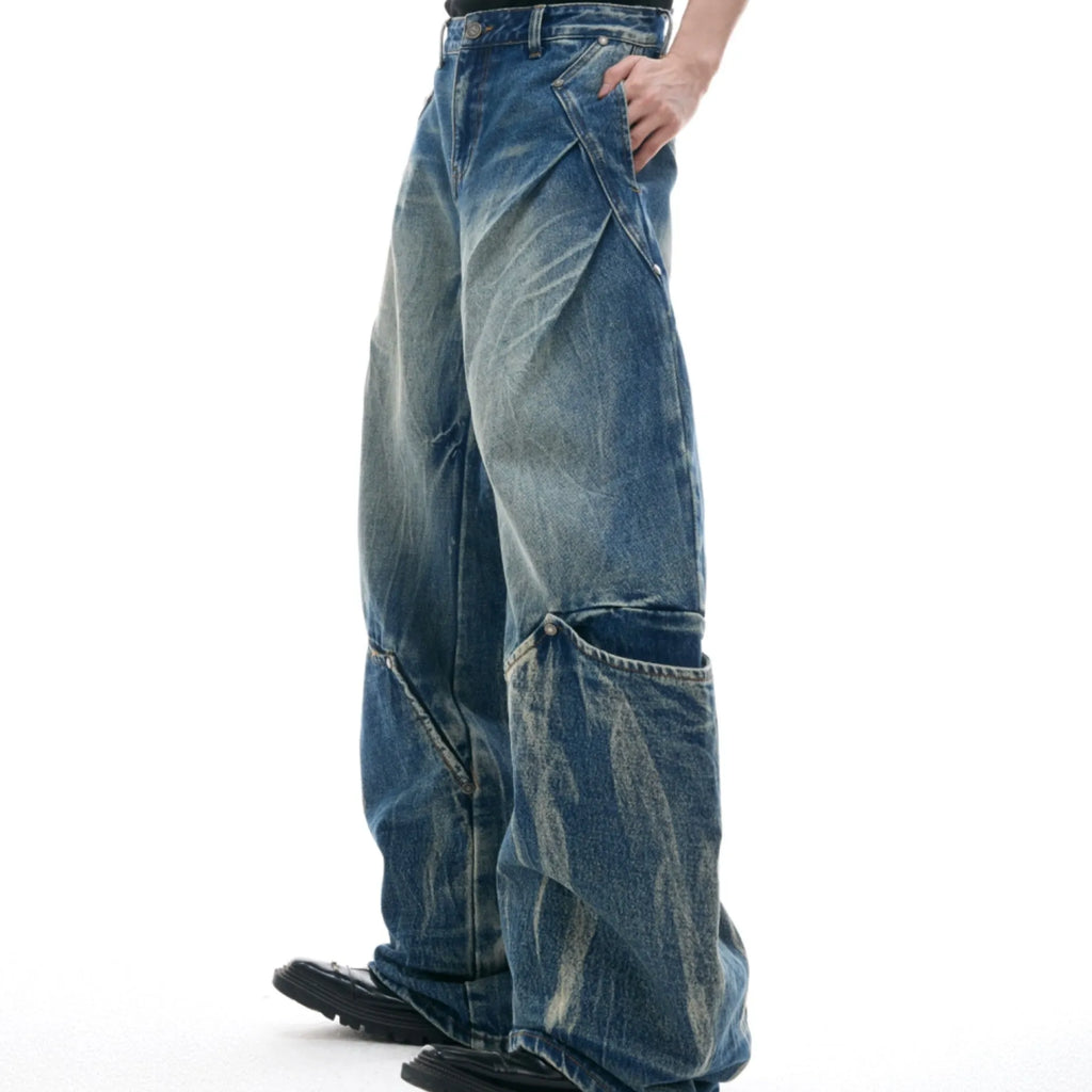 Men's Verdant blue loose-fit retro jeans with a faded burst pattern and curved knife leg design.