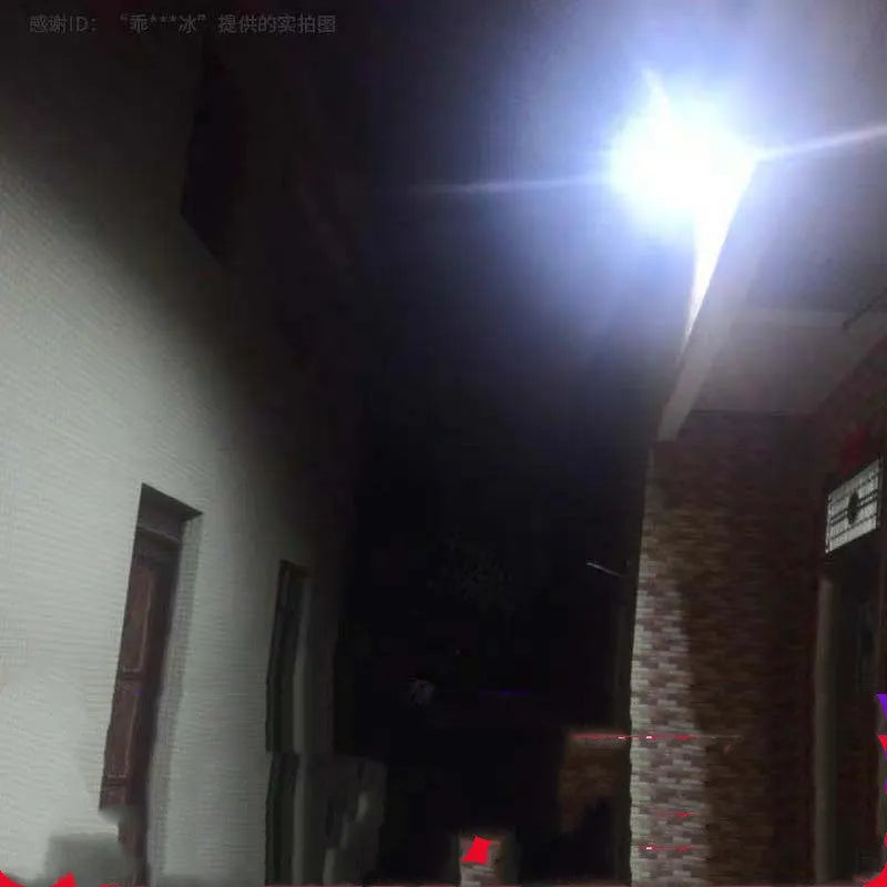 Black solar-powered LED flood light with remote control for outdoor use.
