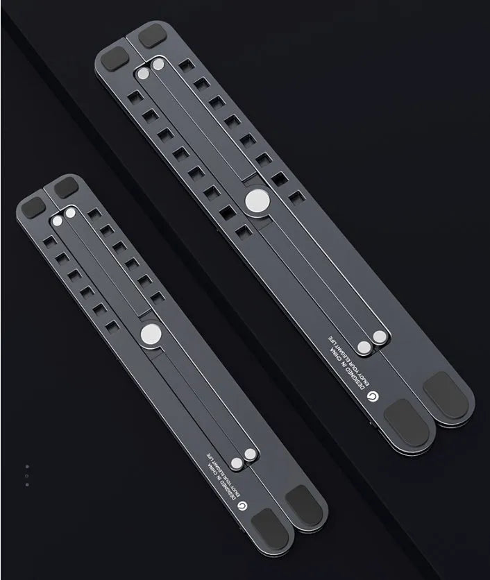Foldable aluminium laptop stand in silver colour, shown adjusted to a height with a laptop on it