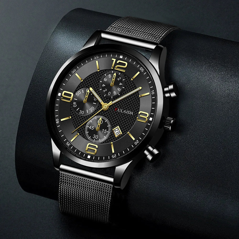 Men's gold shell quartz watch with black dial and mesh alloy strap on a white background