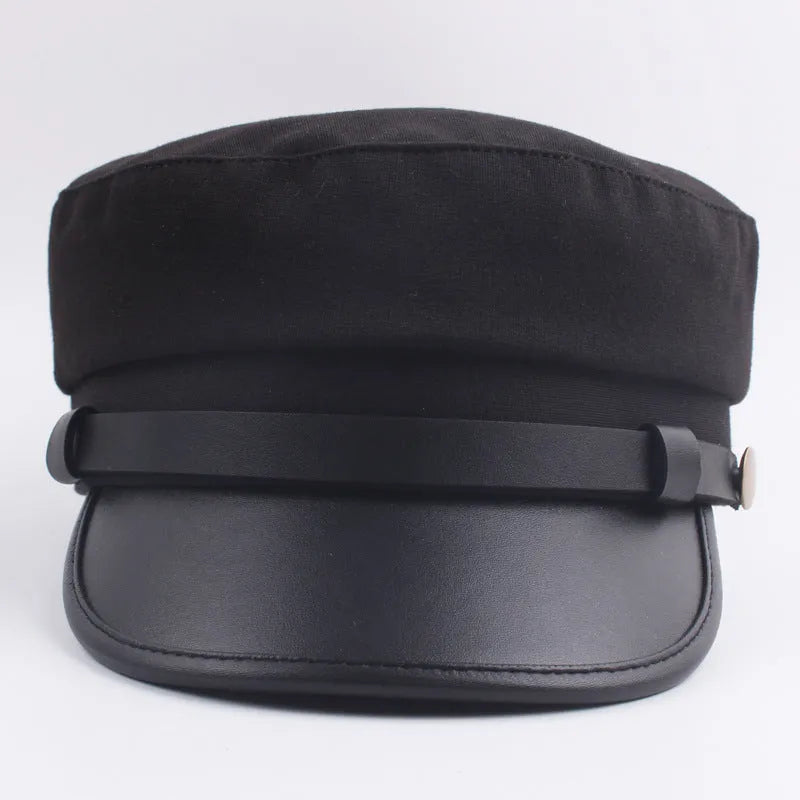 Navy imitation leather flat brim peaked cap with dome crown on white background