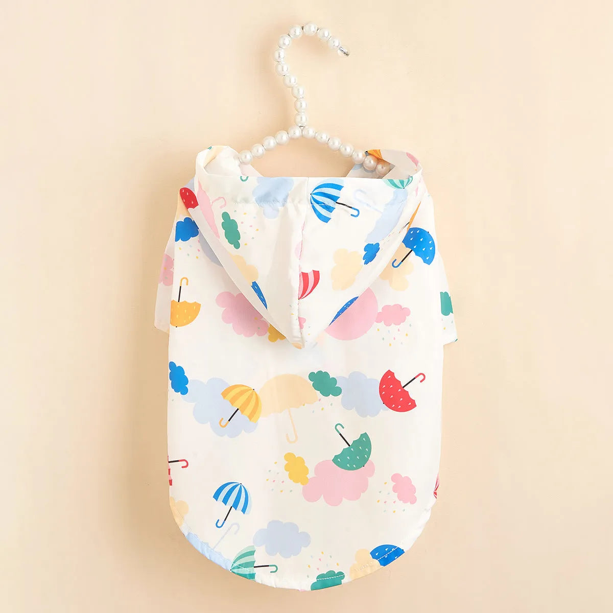 Colourful cartoon umbrella pattern polyester raincoat for a dog or cat, shown in size L.
