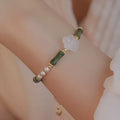 Chinese style women's bracelet with Hetian jade, bamboo joint design, and 4mm shell pearl components