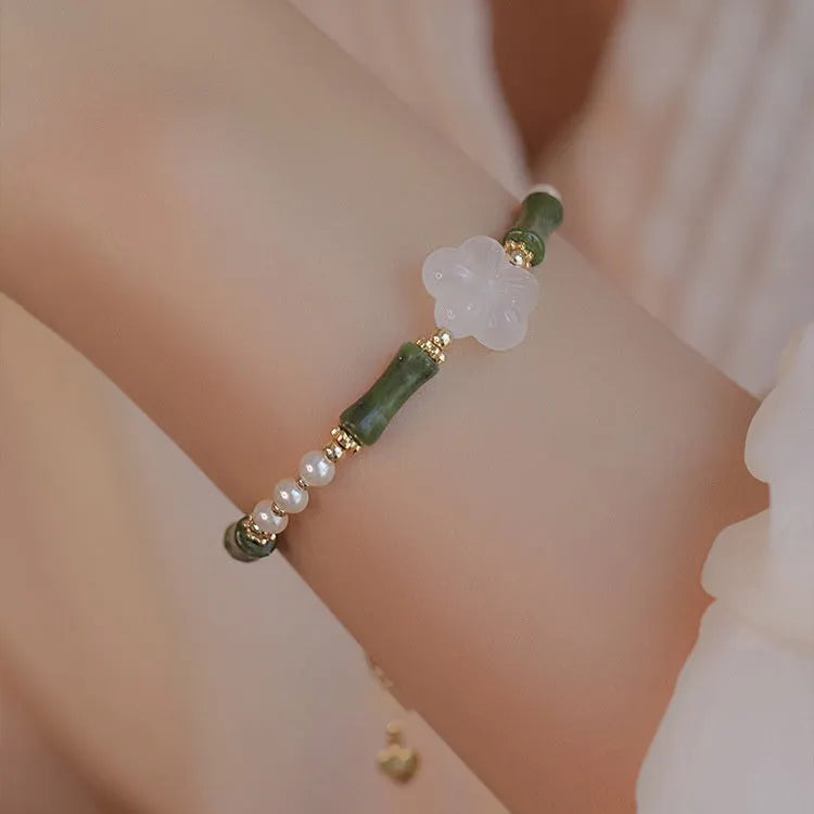 Chinese style women's bracelet with Hetian jade, bamboo joint design, and 4mm shell pearl components