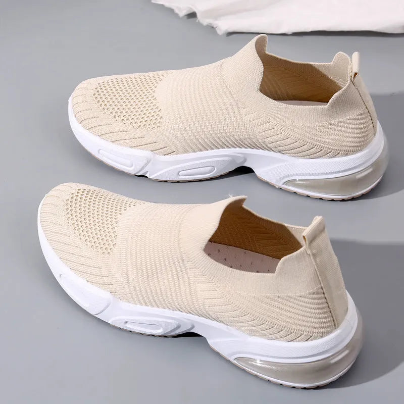 Breathable slip-on sock shoes in black, pink, khaki, and white colours with mesh lining and PVC sole.