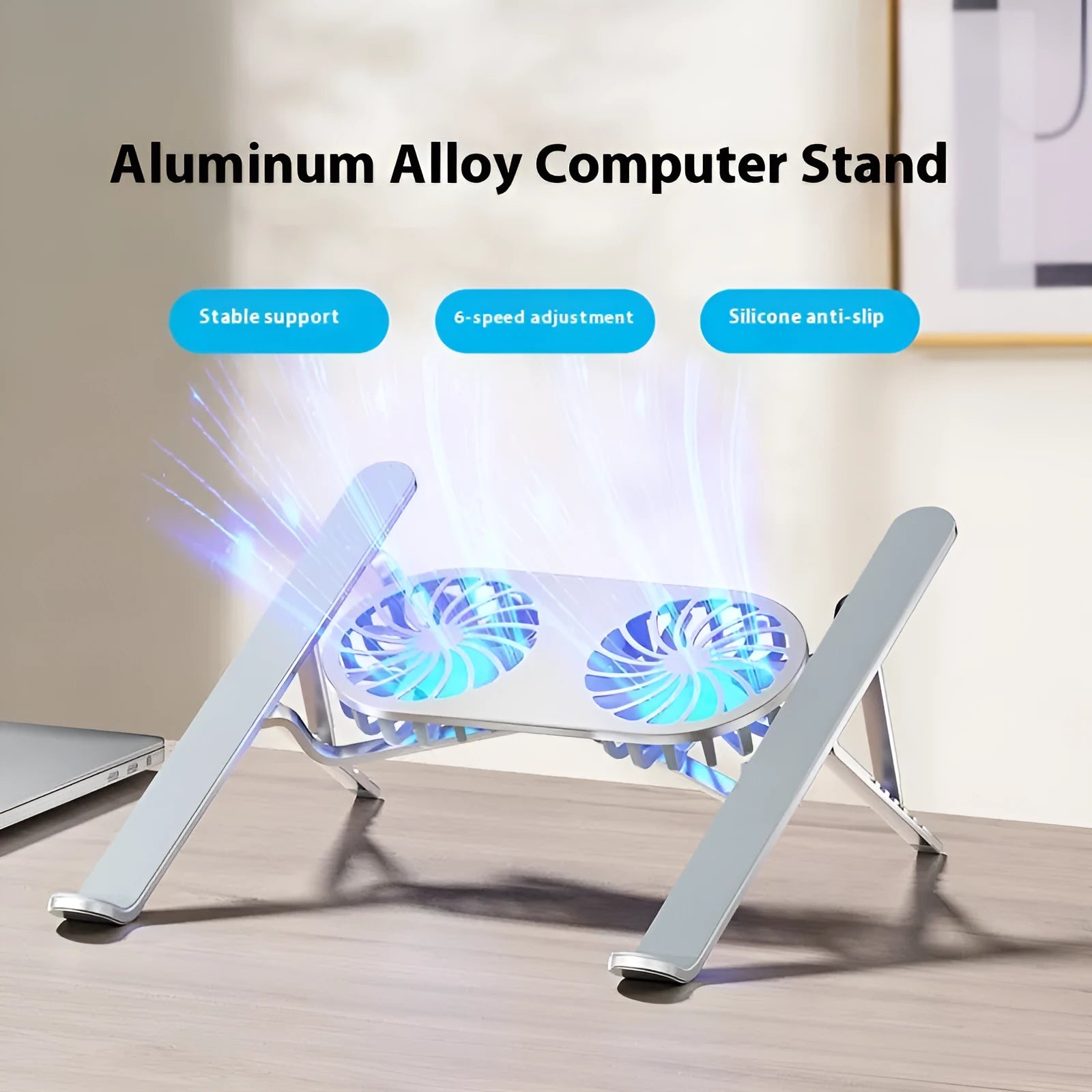 Silver aluminium laptop cooling stand with twin fans and adjustable height, shown folded next to storage bag and USB cable.